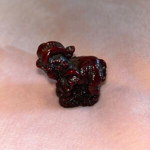 Red resin elephant figurine